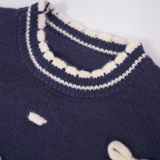 Navy sweater with bows and trims