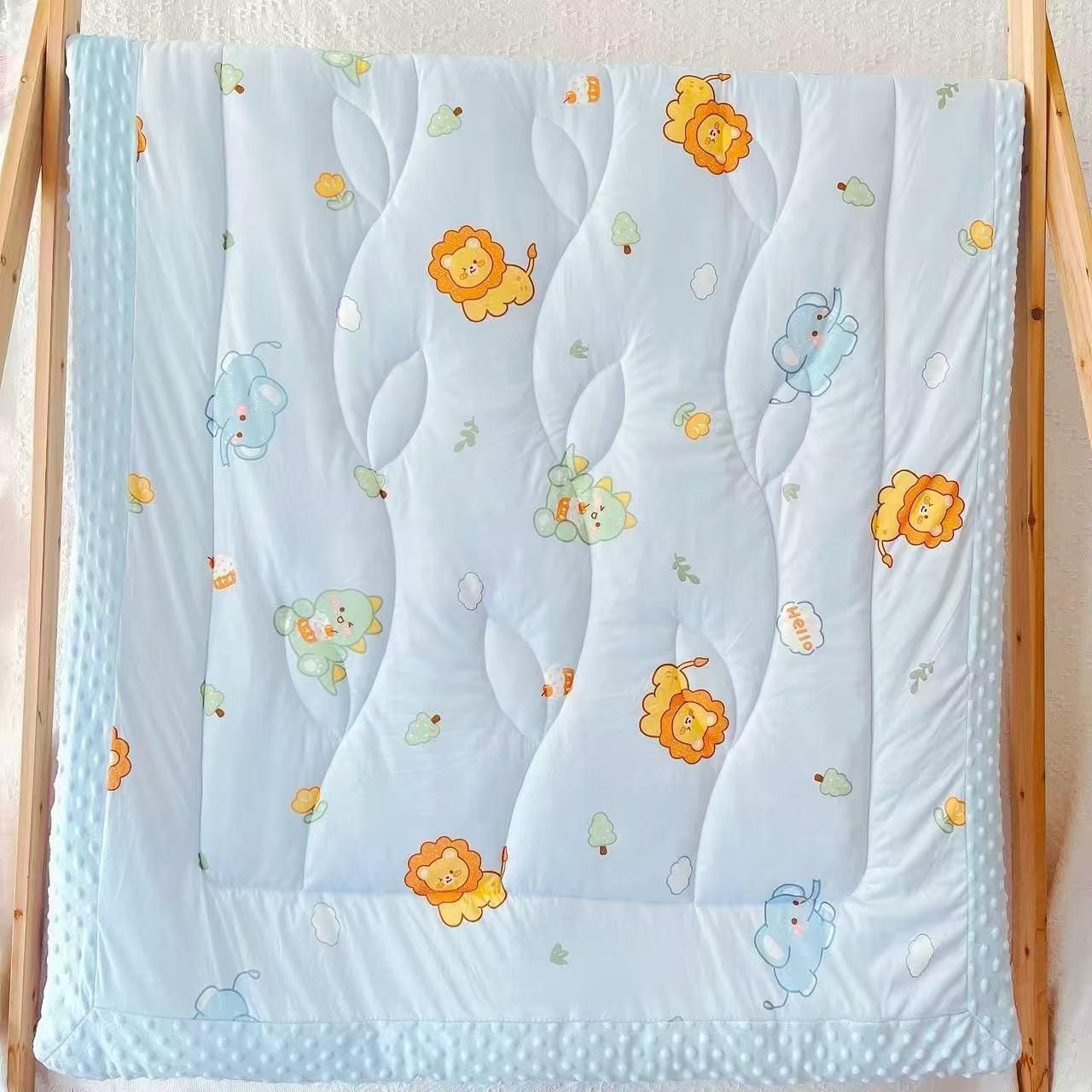 Blue animal print quilt with textured border