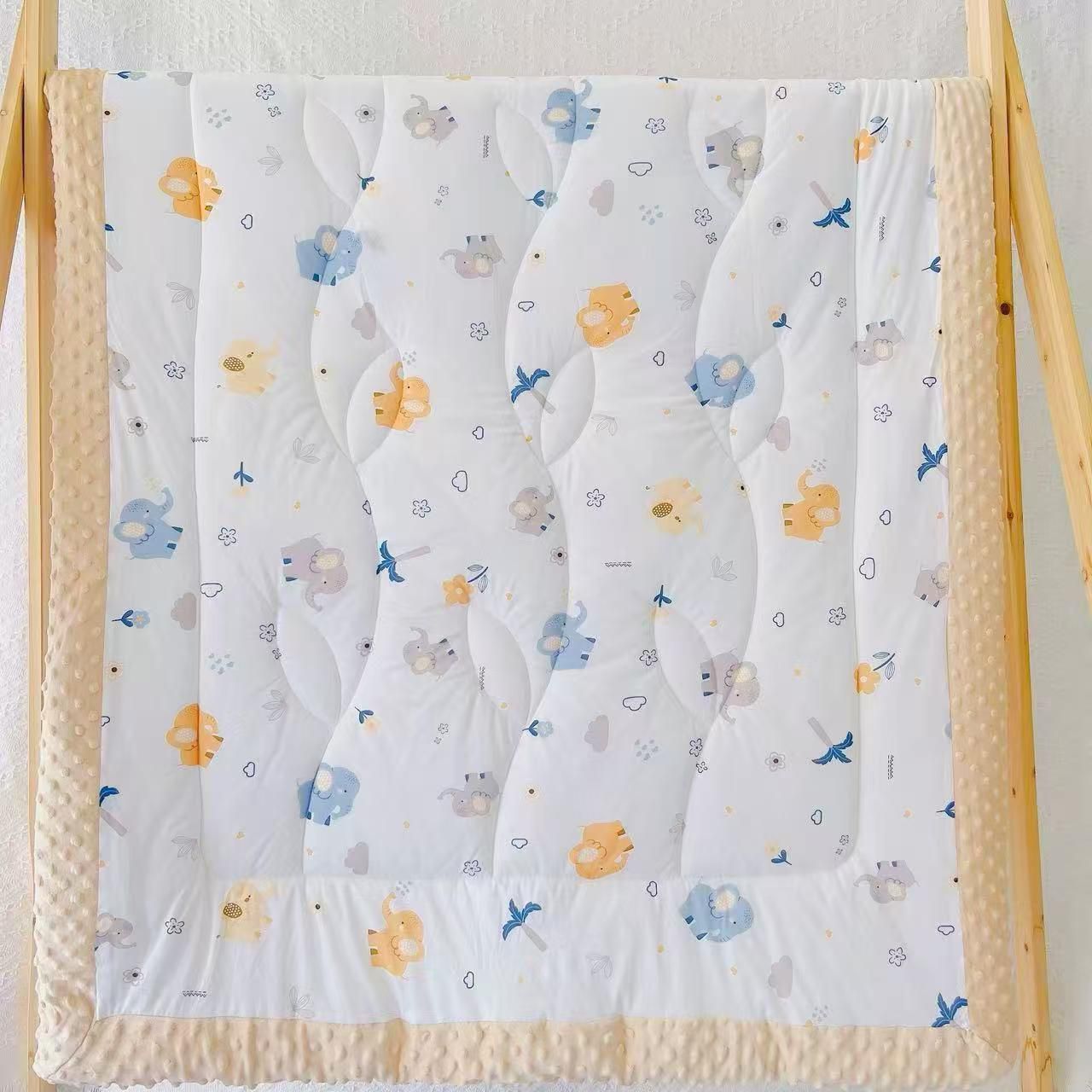 Elephant and bird print quilt with yellow border