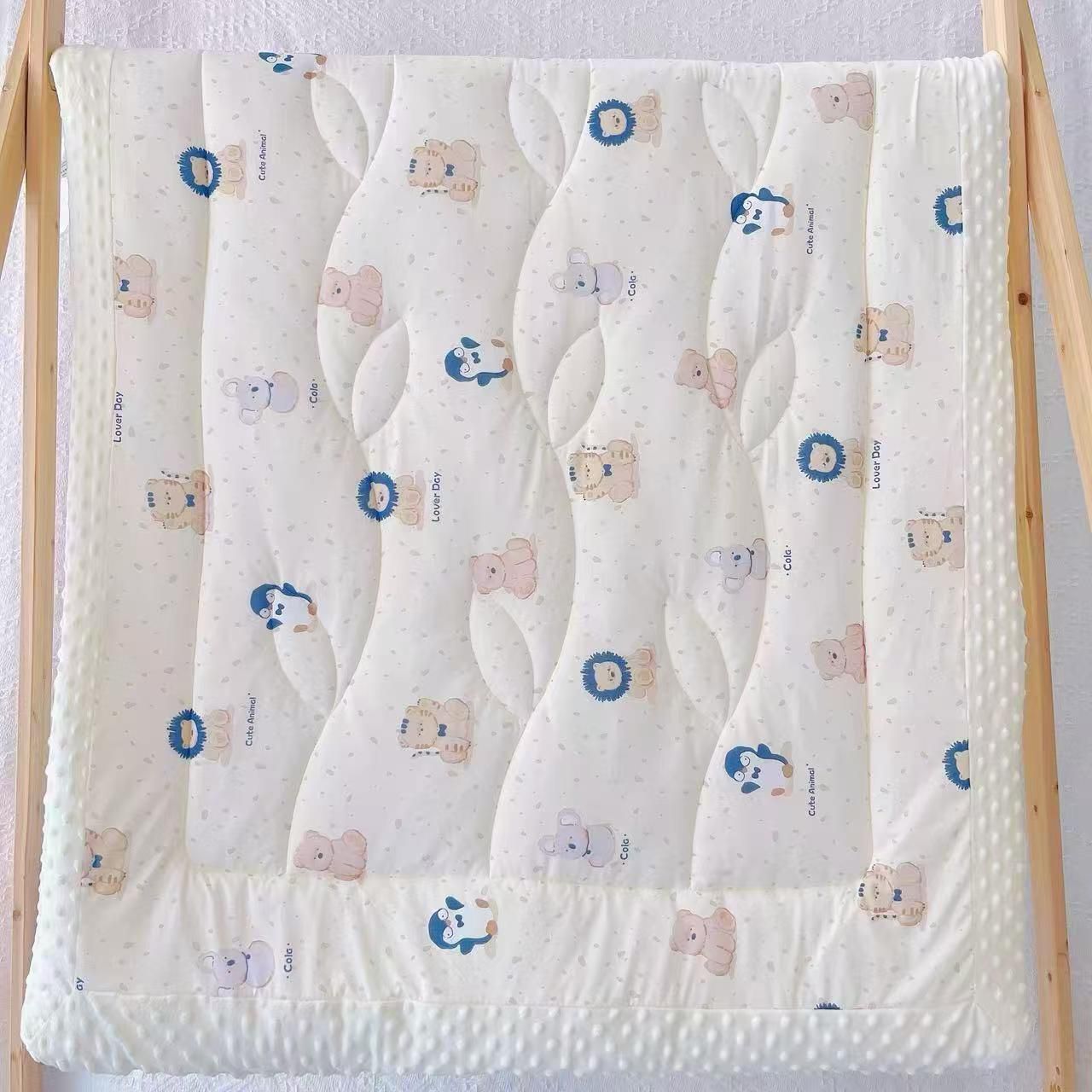Blue quilt with lion and elephant print quilt