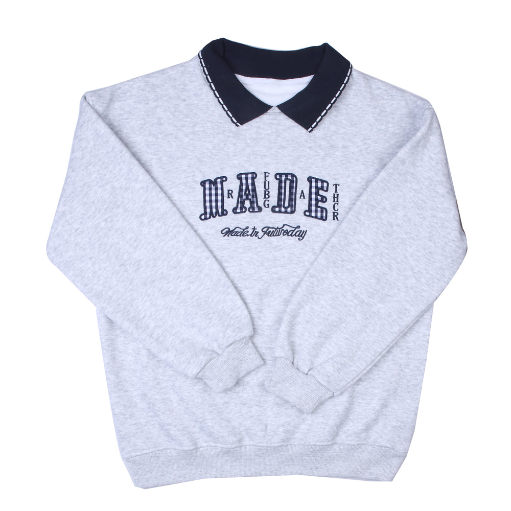 Grey collared T-shirt with navy accents