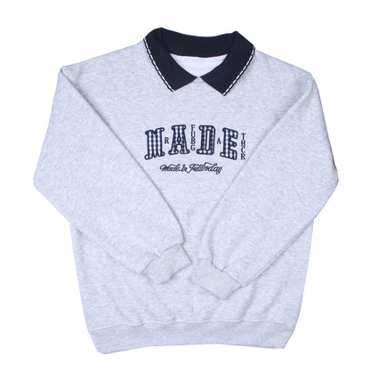 Grey collared T-shirt with navy accents