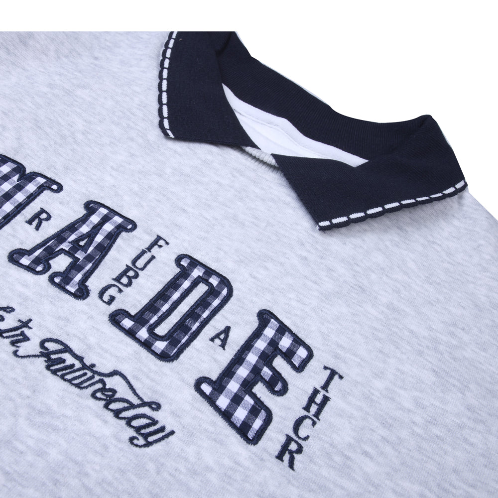 Grey collared T-shirt with navy accents