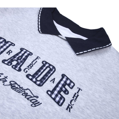 Grey collared T-shirt with navy accents