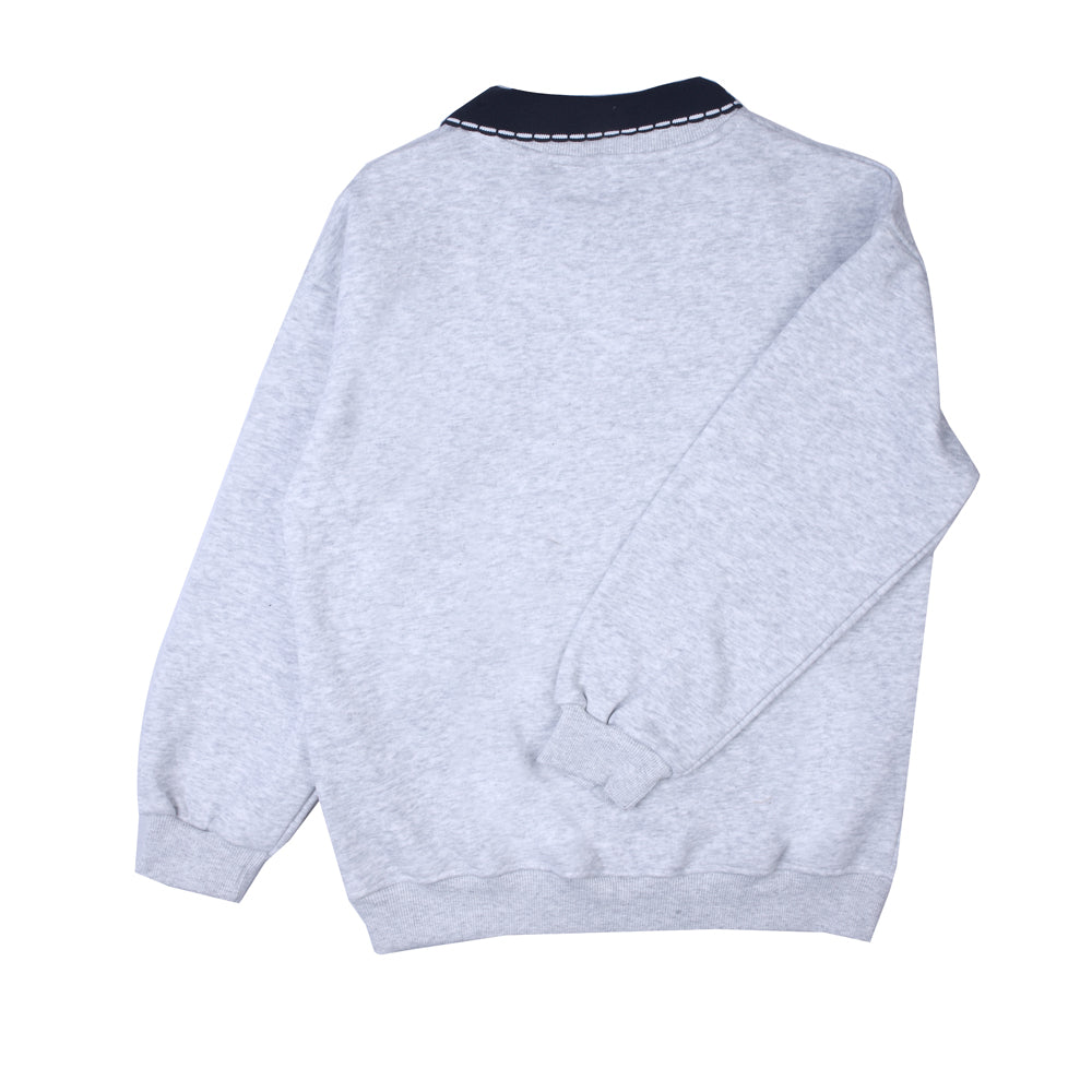 Grey collared T-shirt with navy accents