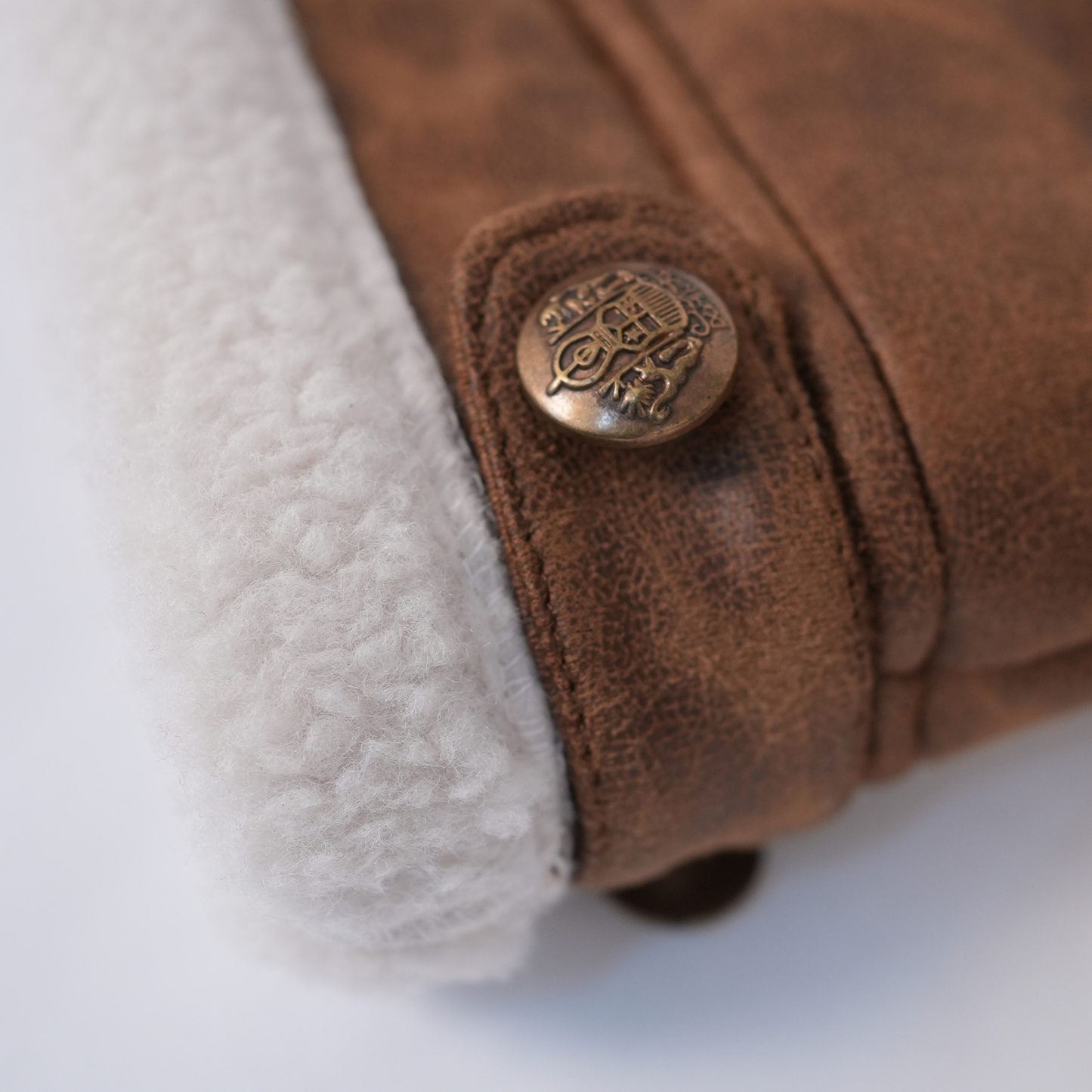 Brown faux-leather jacket with sherpa highlights