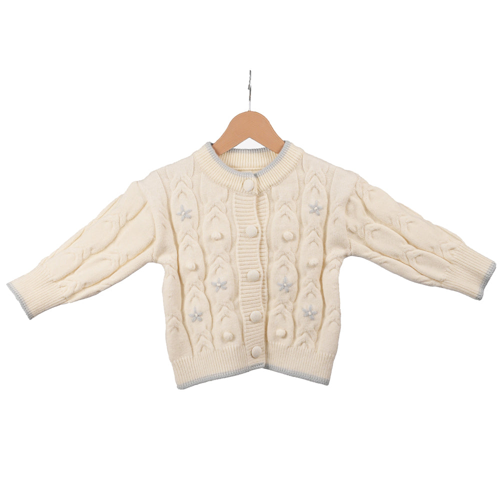 Cream sweater with blue flower accents