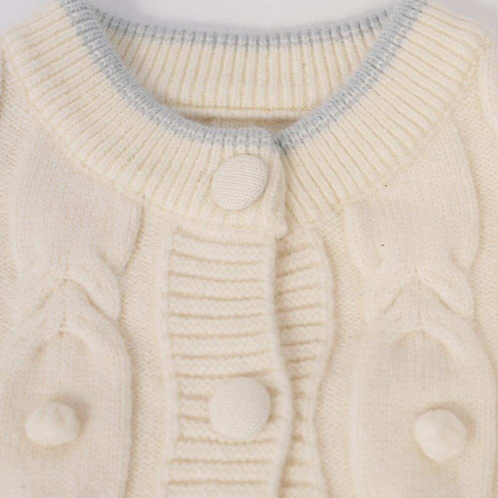 Cream sweater with blue flower accents