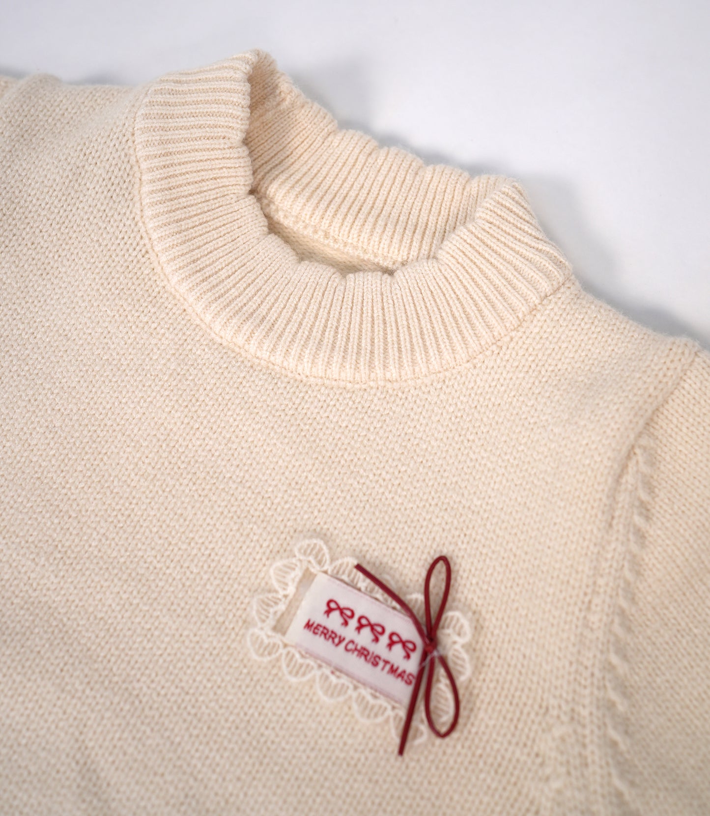 White pom pom sweater