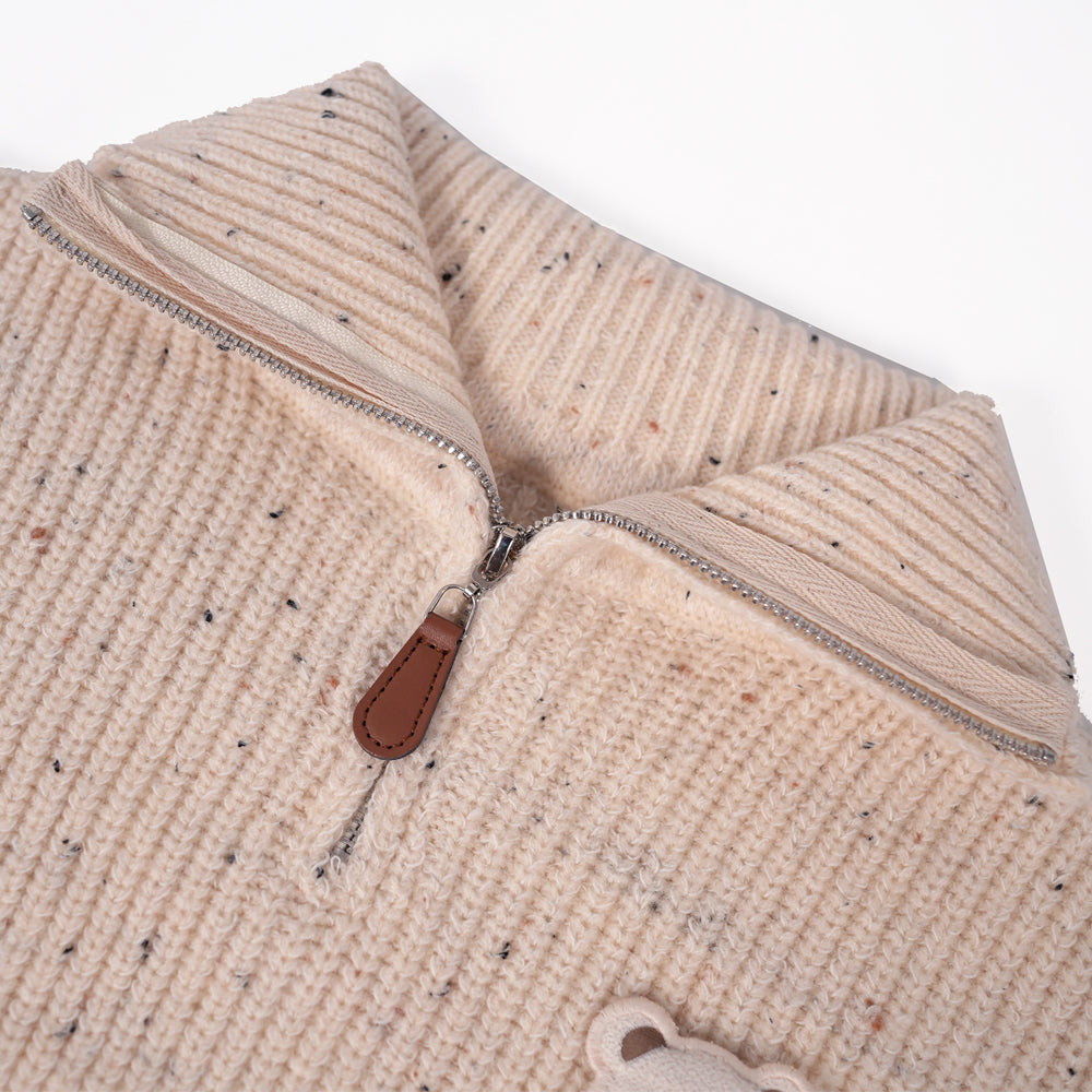 Cream zip-up knit sweater with bear brooche