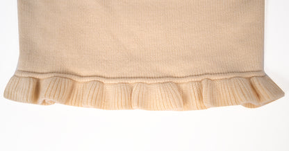 White knit sweater with bow details and frill hem