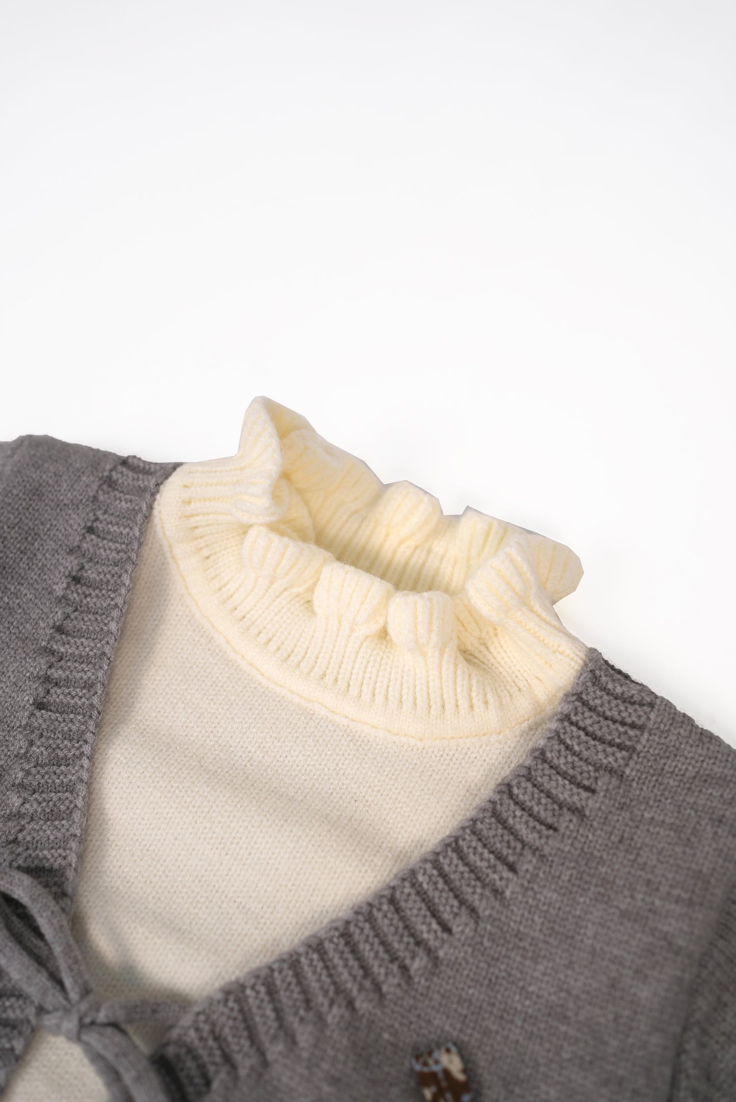 Grey knit cardigan set with cream inner top