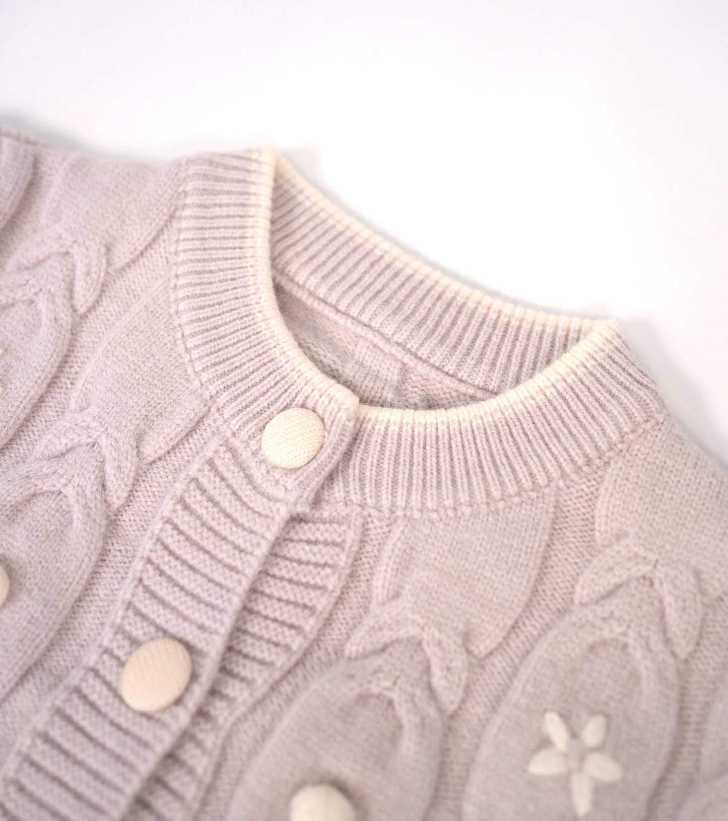 Dusty lilac sweater with white flower accents