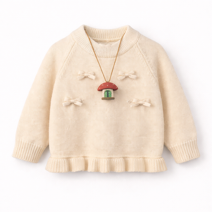 White knit sweater with bow details and frill hem